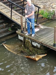 Removing rubbish from the river