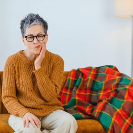 Lady with face pain, TMJ pain, jaw pain,